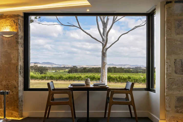 Private dining experience with vineyard views at the Appellation restaurant at The Louise luxury resort in the Barossa Valley of Australia.