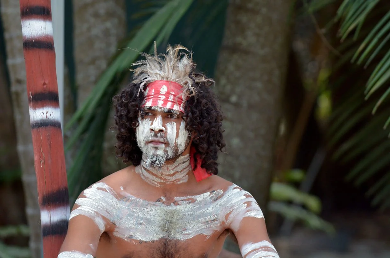 Portrait of one Yugambeh Aboriginal warrior man covered with body painting during Aboriginal culture during cultural show in Queensland, Australia