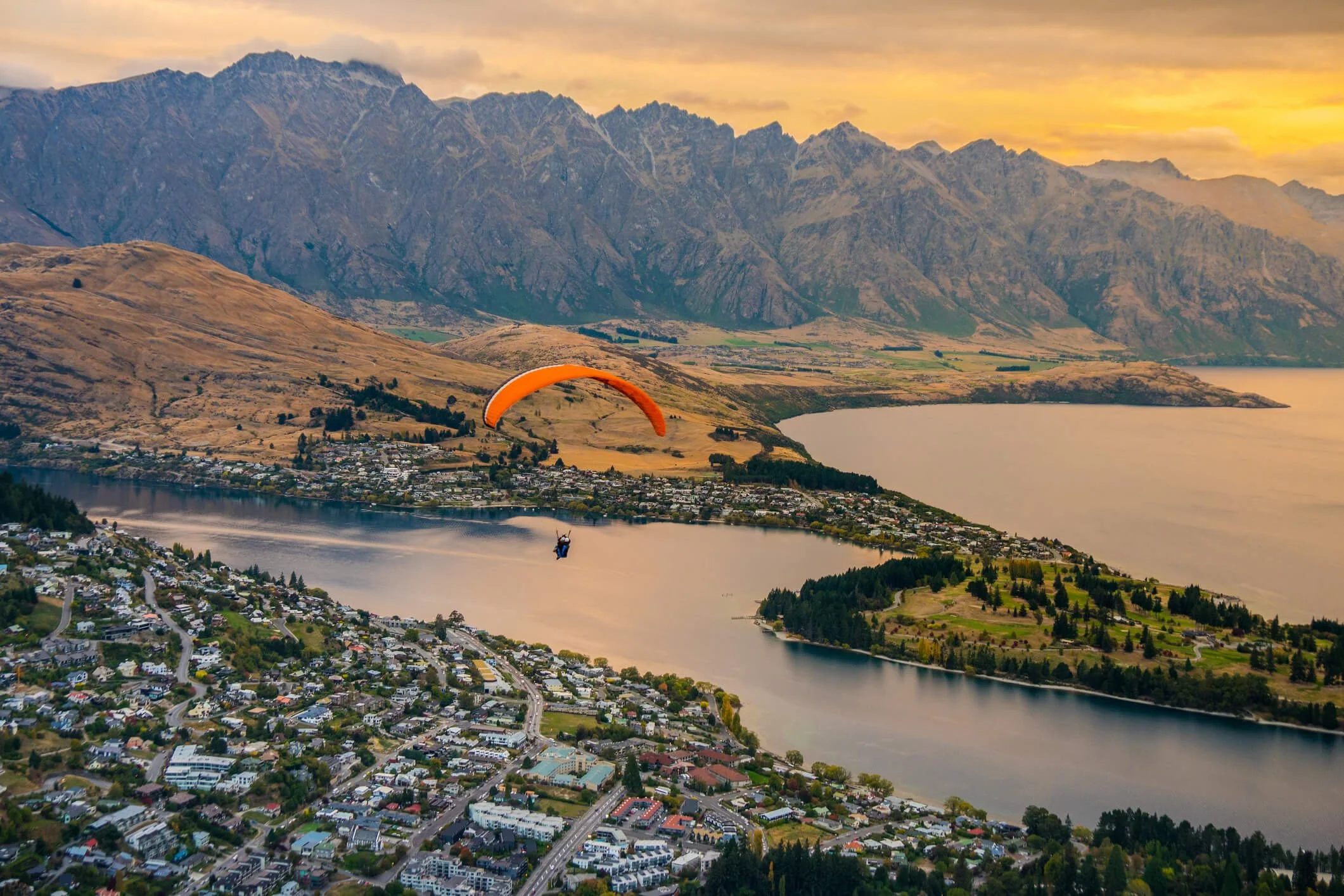 Peron paragliding over Queenstown and Lake Wakaitipu, New Zealand