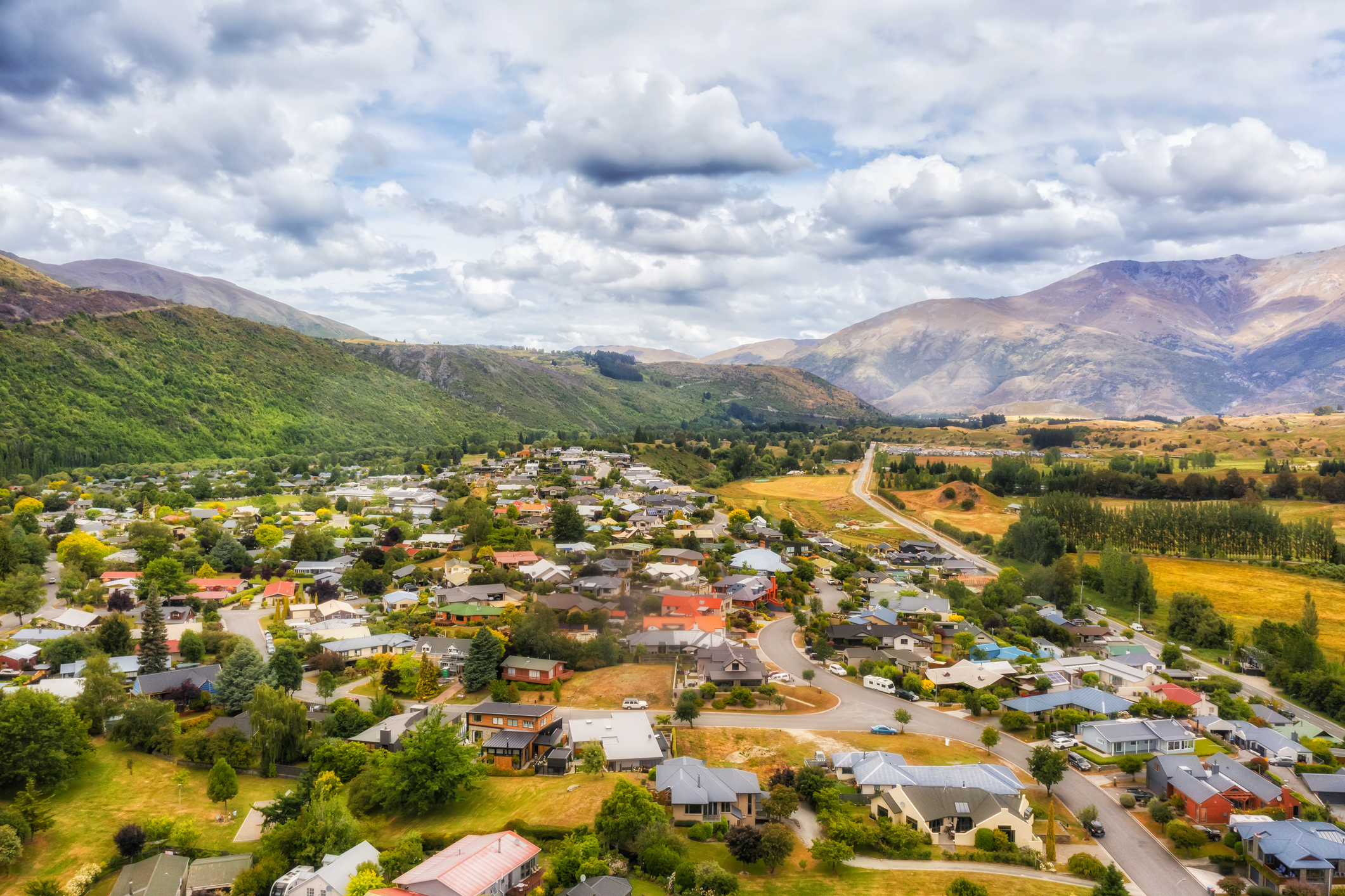 Aerial landscape view of Historic Arrowtown in New Zealand mountain region of Otago by Arrow River