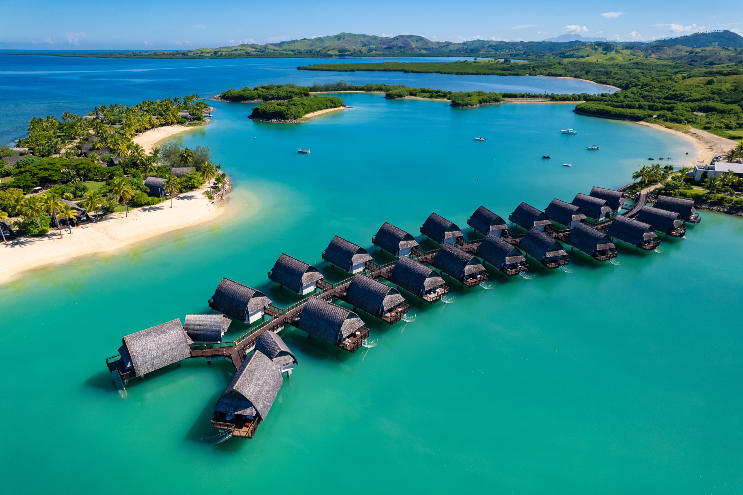 Aerial view of luxury Fiji Resort, overwater bungalows.