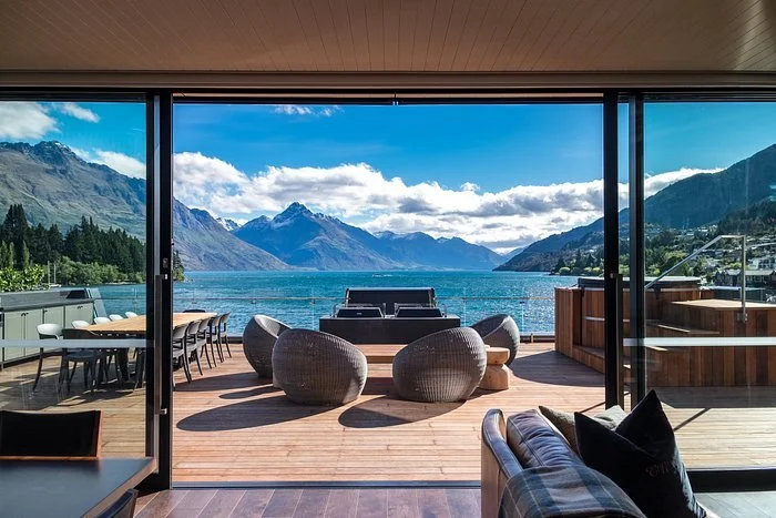 This is the penthouse suite at Eichardt's Private Hotel in Queenstown, New Zealand, featuring a expansive private terrace with Lake Wakatipu views.