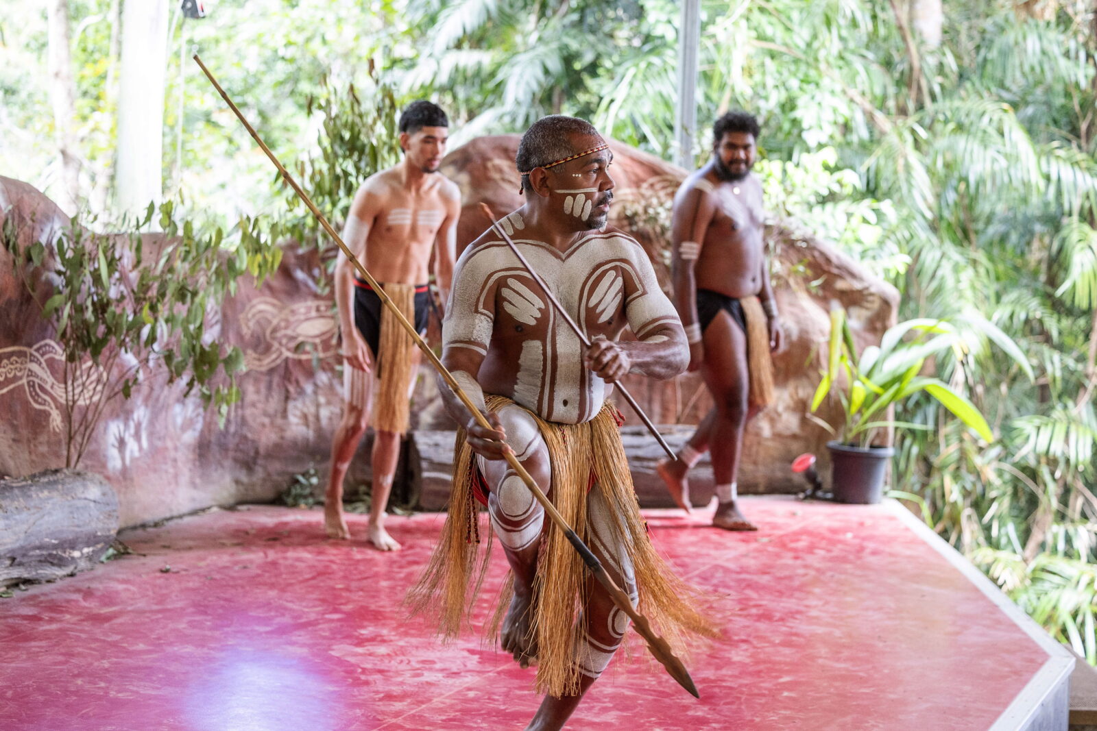 The Pamagirri Aboriginal Experience dancers, adorned in vibrant ceremonial attire, showcase their cultural heritage through rhythmic movements, storytelling, and music.