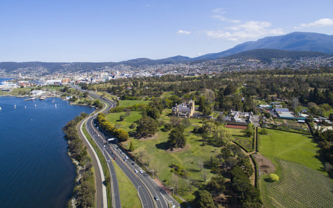 Aerial view of Hobart's Derwent River facing CBD, including Government House and Macquarie Point.