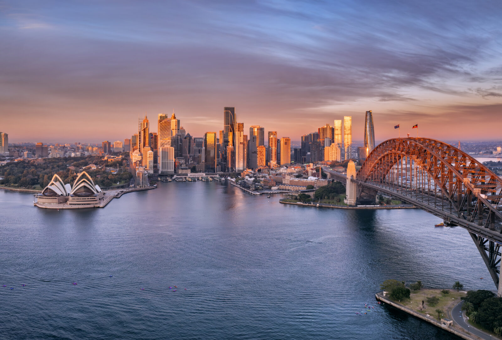 Aerial sunrise scenic view of Sydney city Harbour waterfront cityscape.